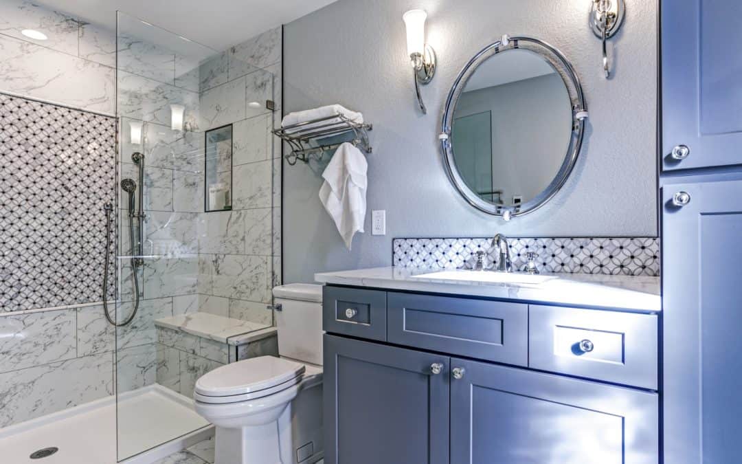 Elegant bathroom with marble tiles, glass shower, and stylish vanity.