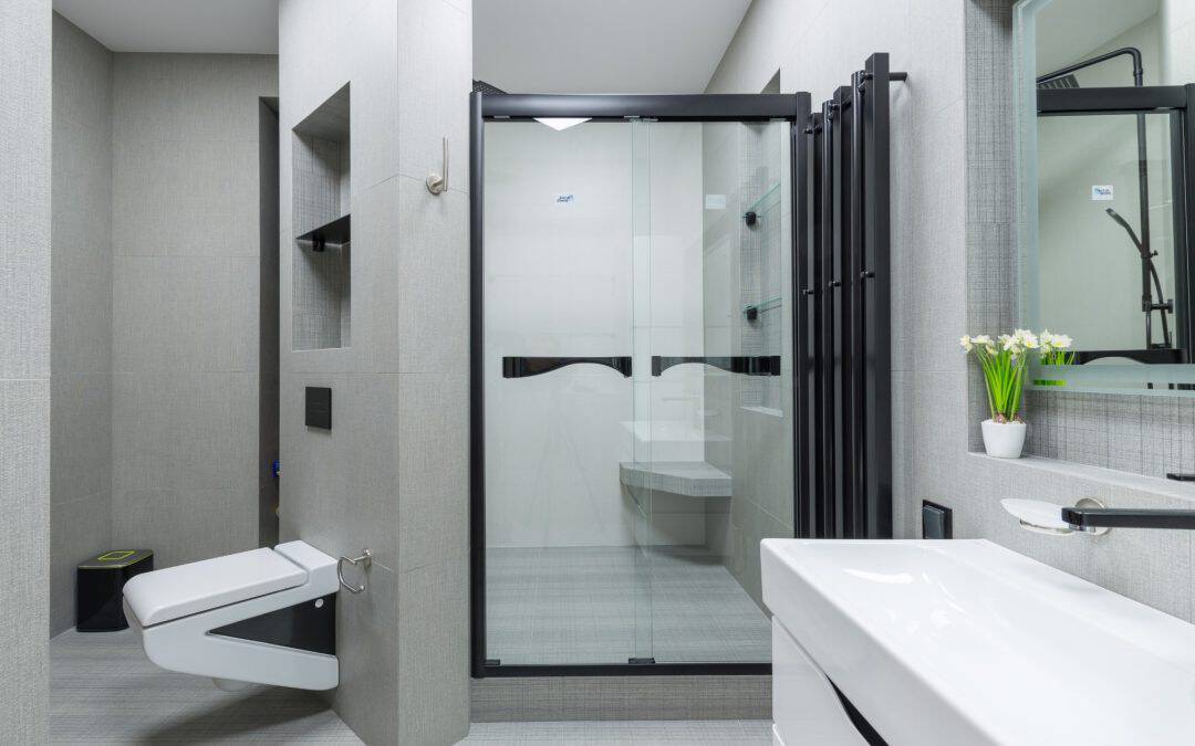 Elegant walk-in shower with glass enclosure and sleek fixtures.