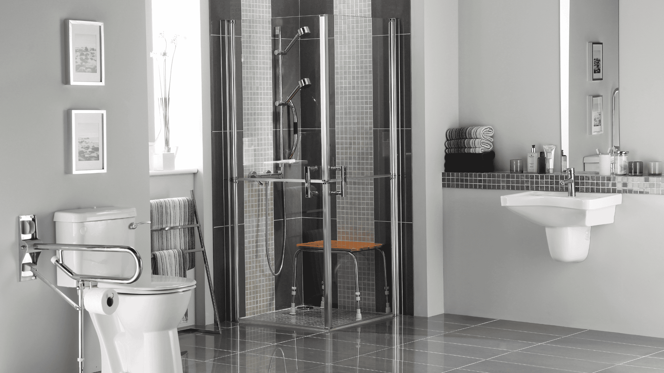 Contemporary bathroom with walk-in shower, toilet, and sink, featuring sleek design and modern fixtu.