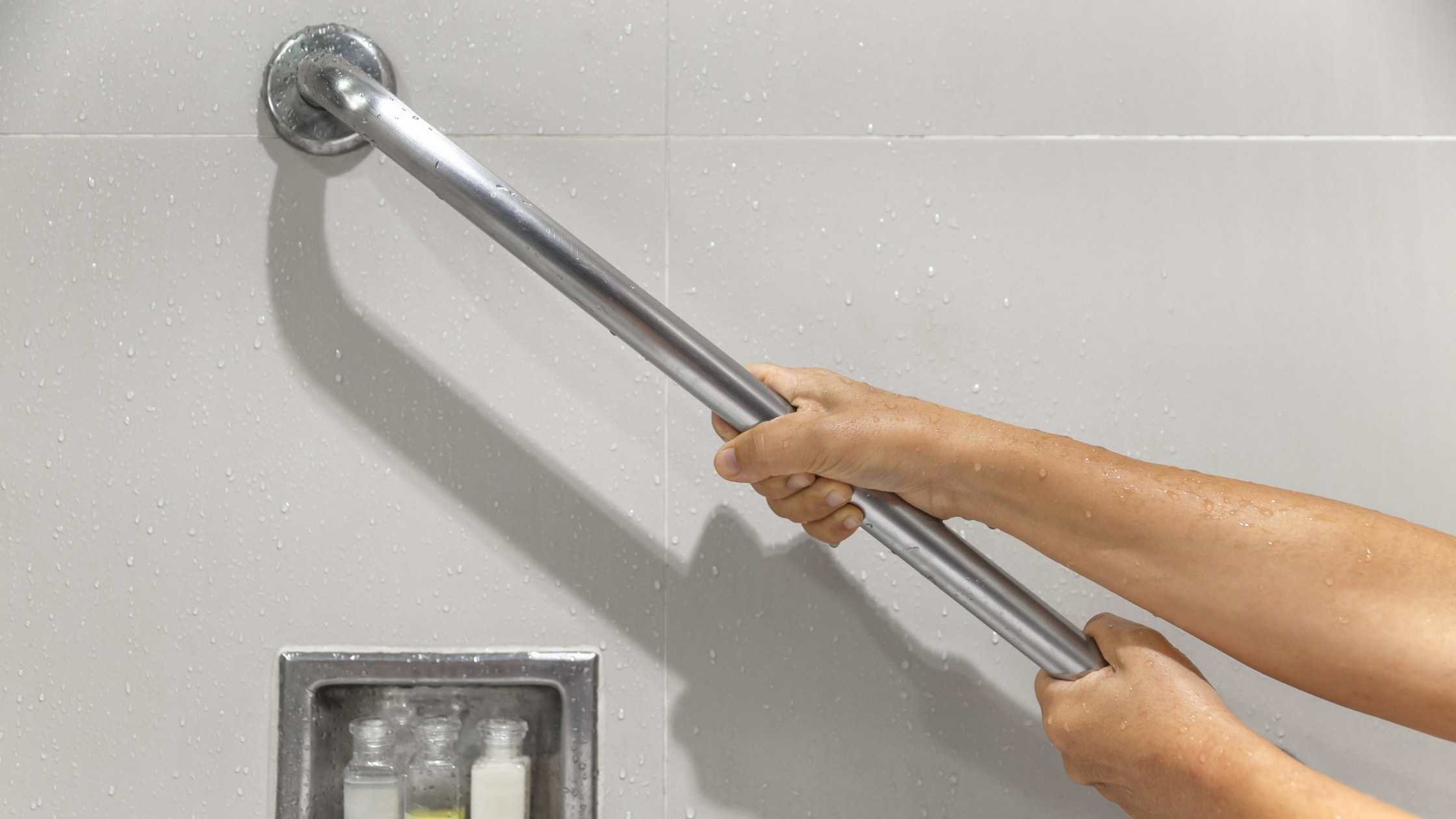 Accessible shower safety grab bar for elderly and disabled users.