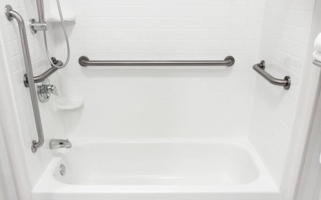Accessible bathtub with grab bars and shower fixtures for safe bathing.