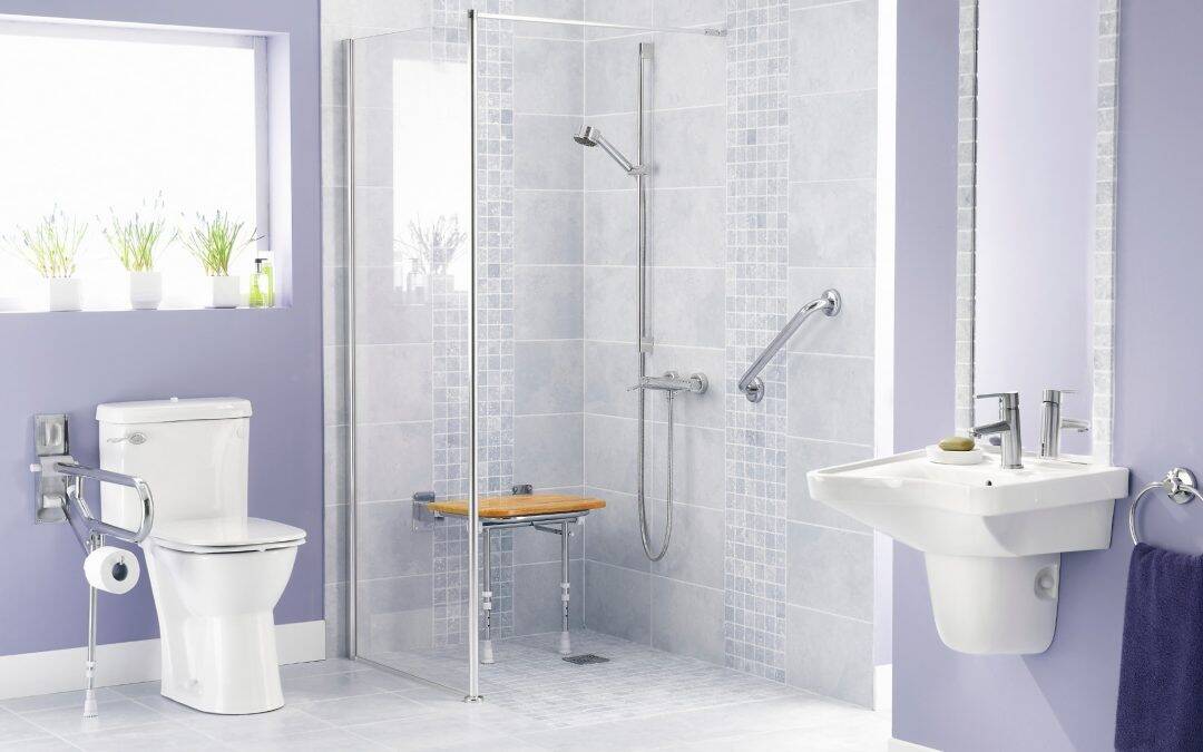 Accessible shower with grab bars and a wooden bench for safety and comfort.
