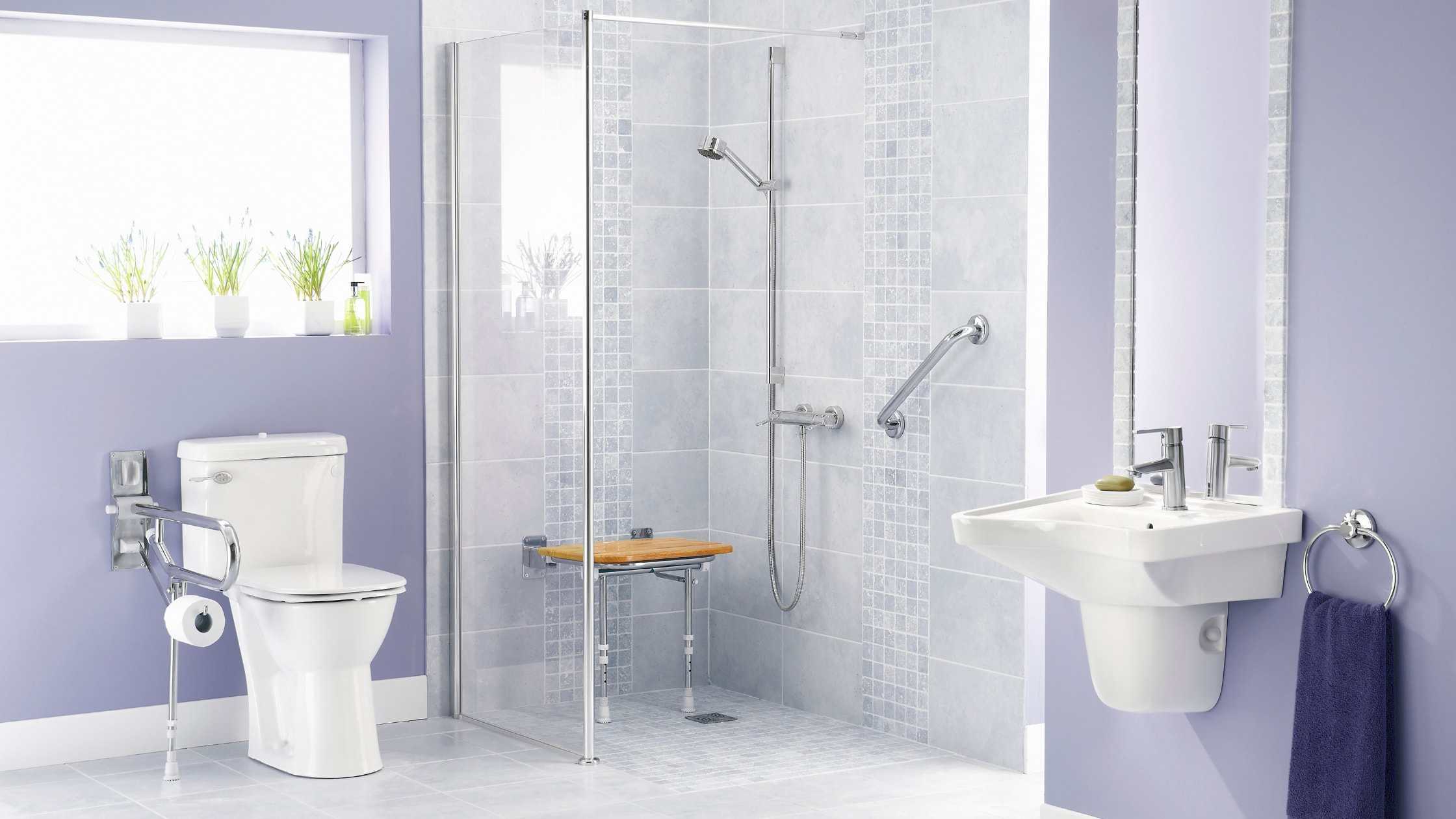 Accessible shower with grab bars and a wooden bench for safety and comfort.