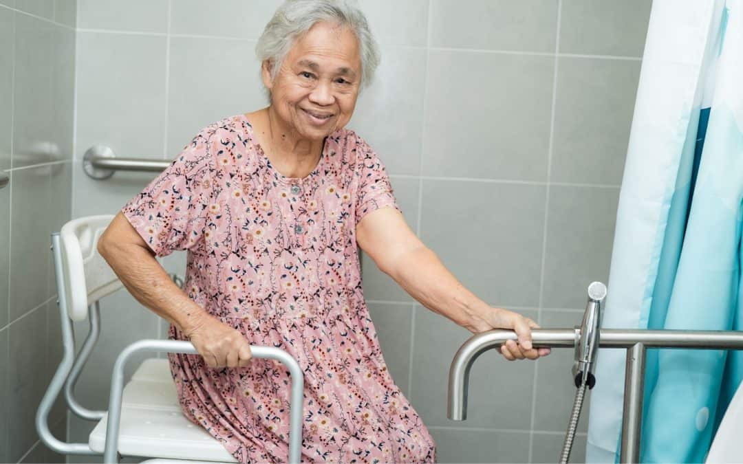 Elderly woman using a walk-in bathtub with safety grab bars for assisted bathing.