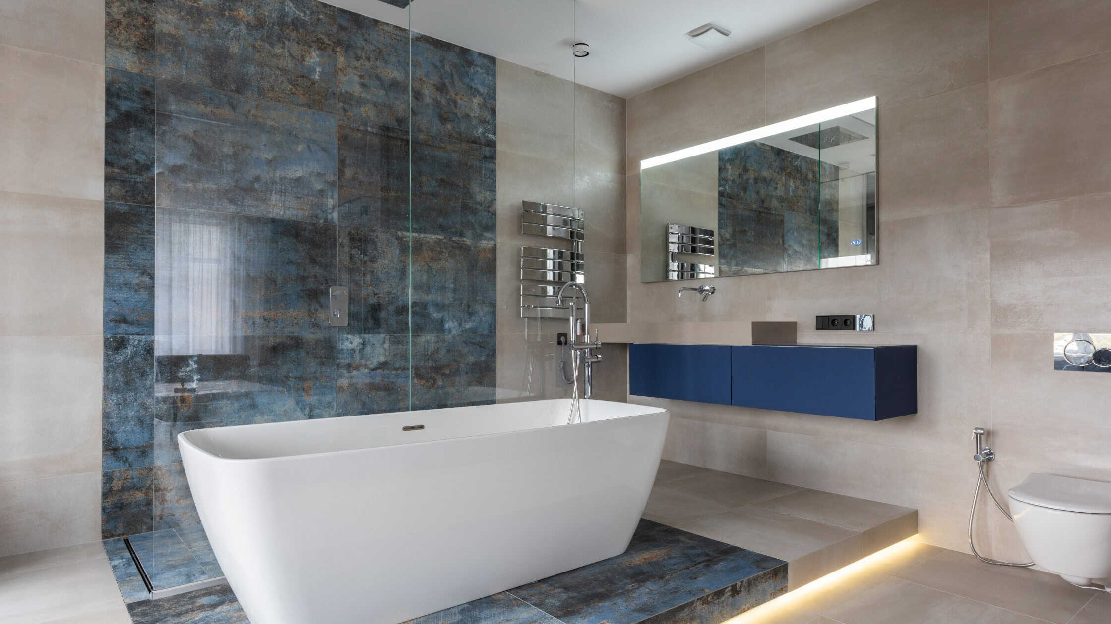 Elegant modern bathroom featuring a freestanding bathtub and contemporary design elements.