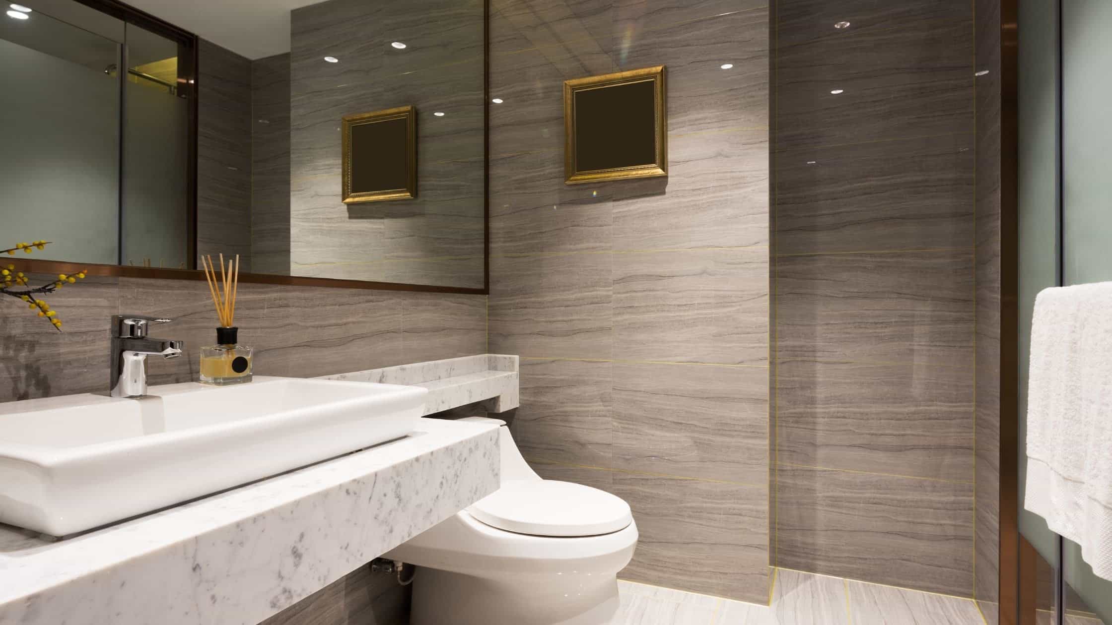 Modern bathroom featuring a sleek marble sink and contemporary decor.