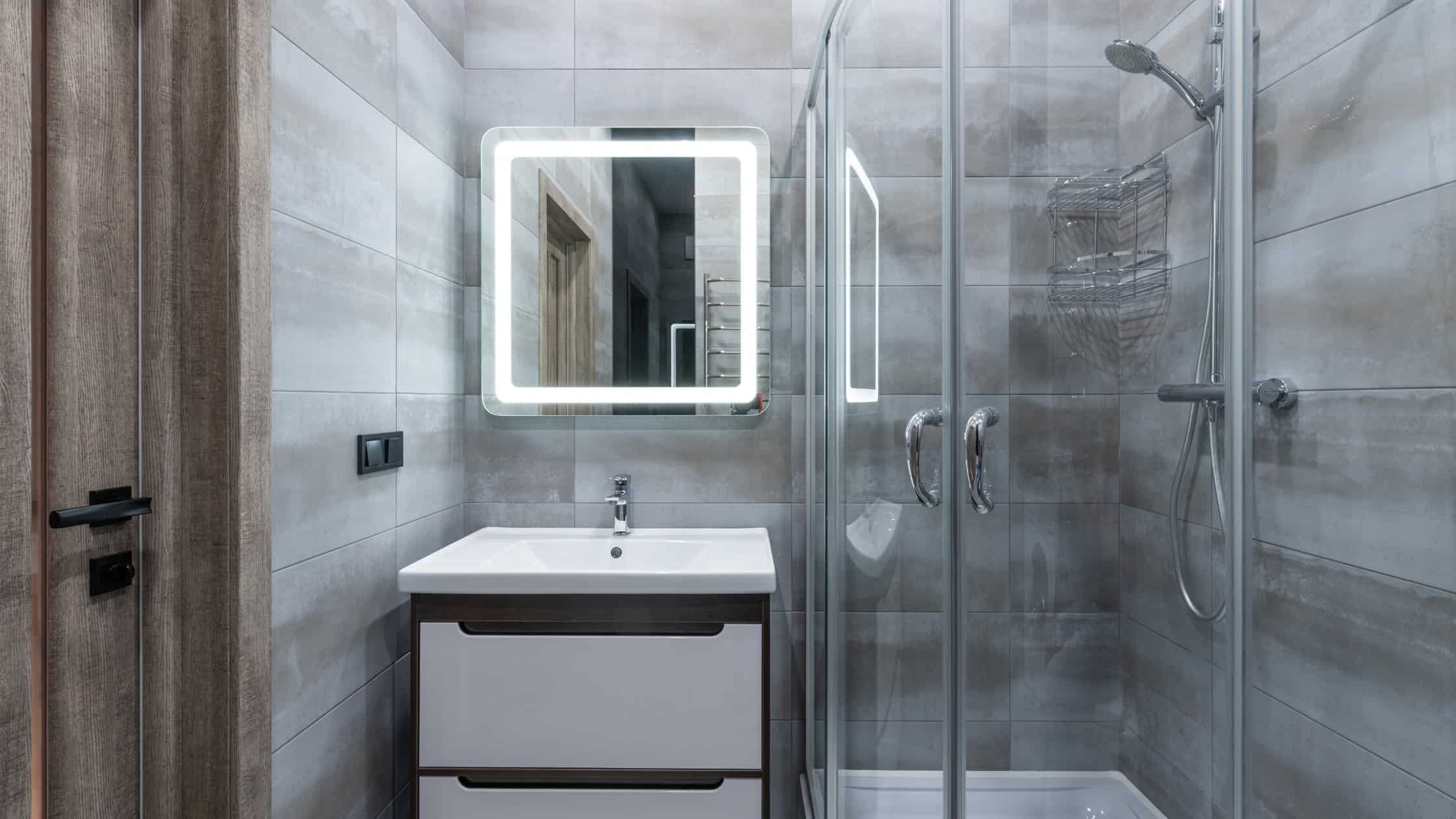 Contemporary bathroom with glass shower enclosure and sleek vanity for modern home design.