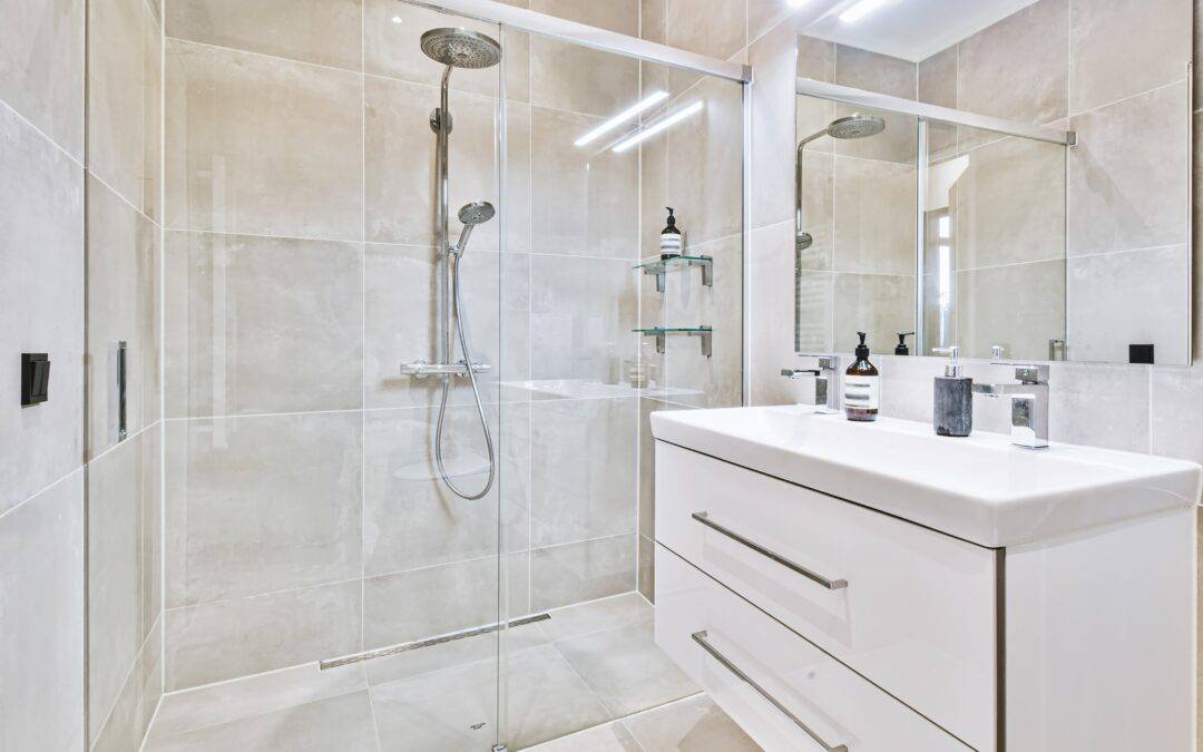 Modern bathroom shower with glass enclosure and sleek fixtures.