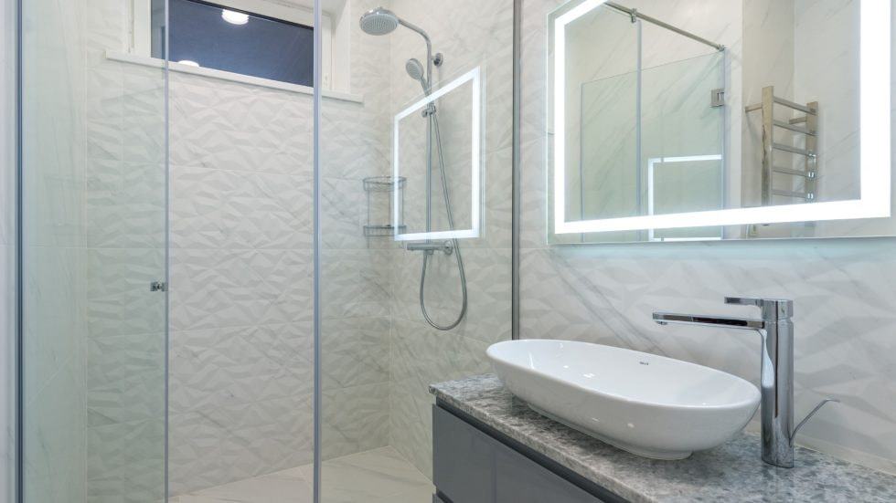 Contemporary bathroom with walk-in shower and stylish fixtures.