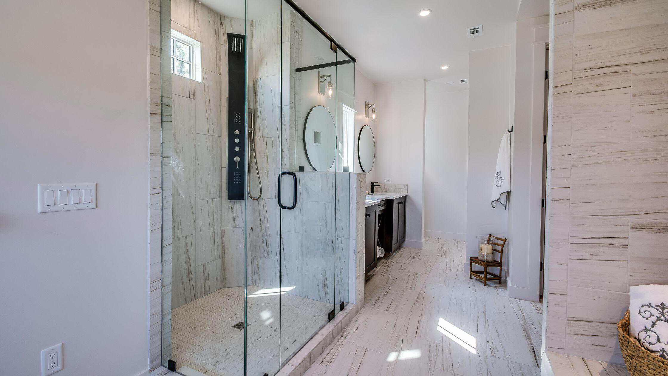 Modern Bathroom Shower Area Luxury walk-in shower with glass enclosure and sleek fixtures.